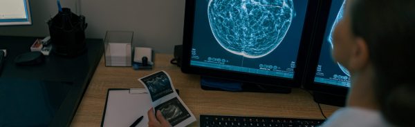 Female doctor neuroscientist analyzing scan MRI images in hospital. High quality photo